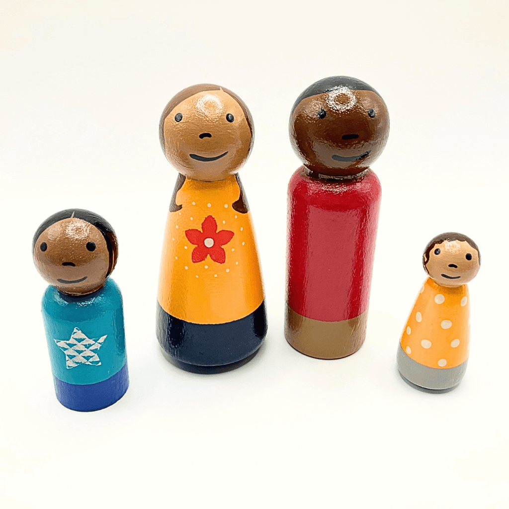 Set of colorful wooden dolls with different hairstyles and outfits on a white background