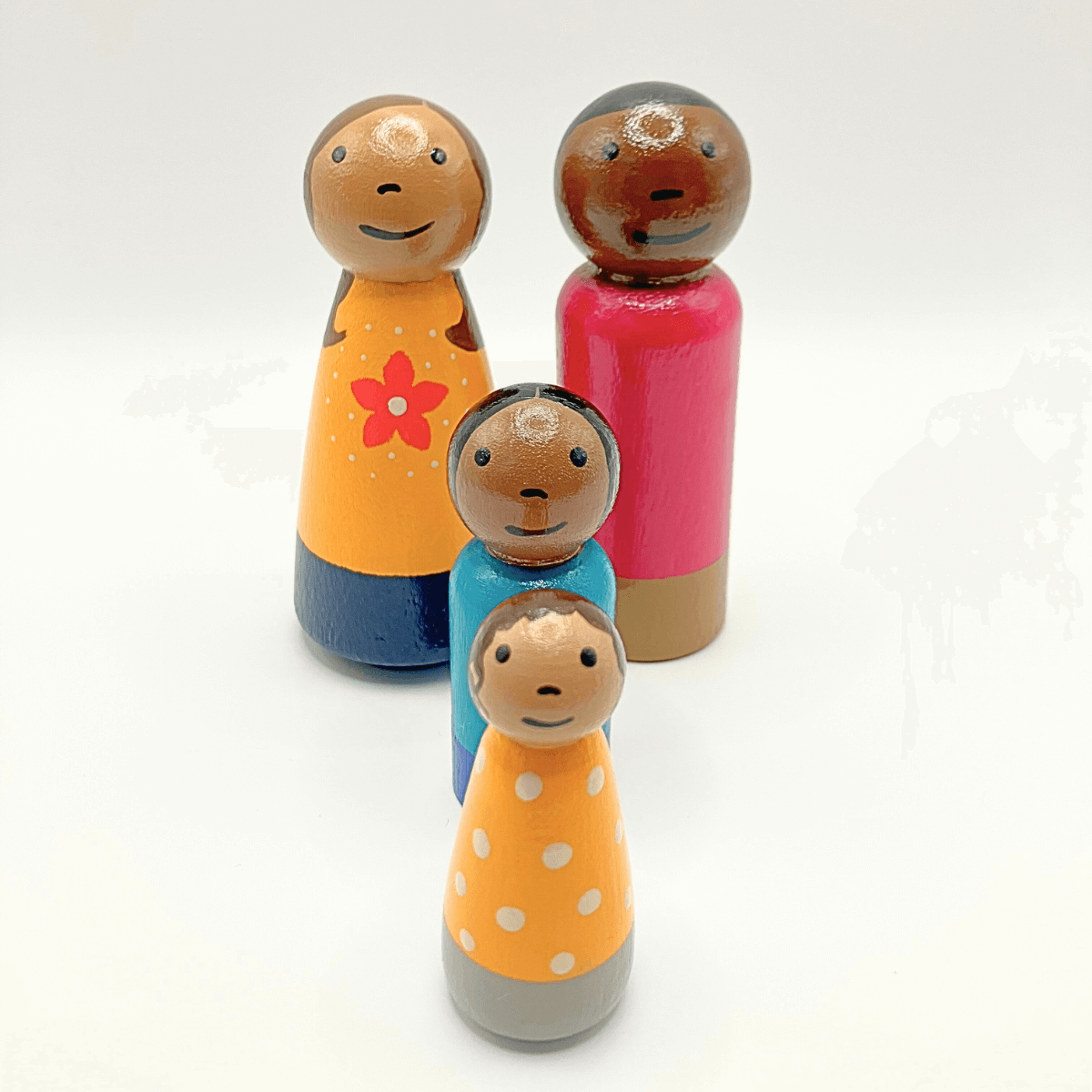 Set of colorful wooden dolls on a white background