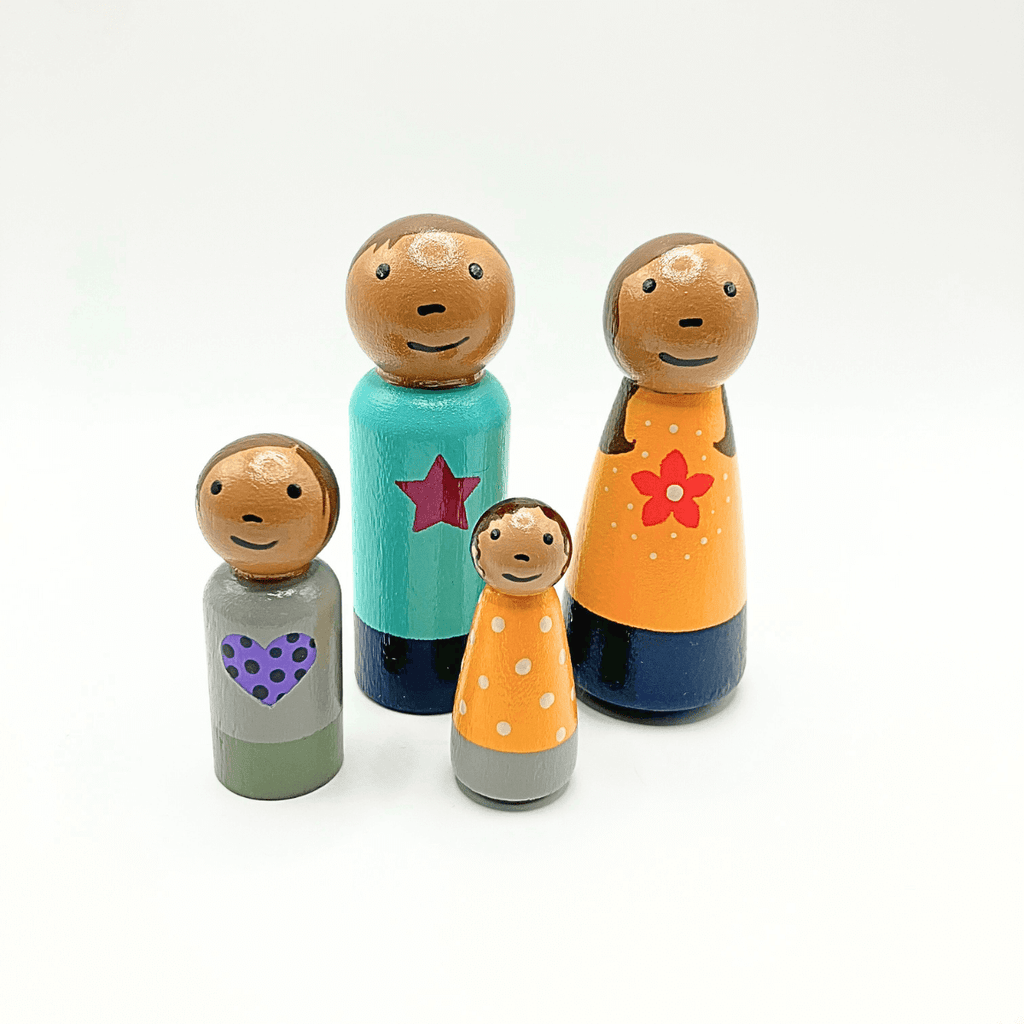 Set of colorful wooden family figurines on a white background