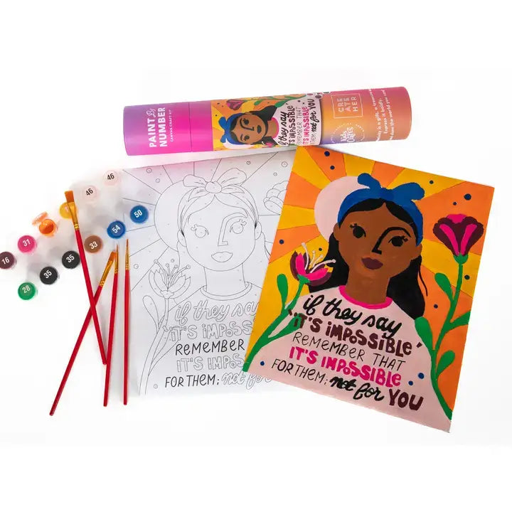 Coloring book with illustrations and paint supplies on a white background