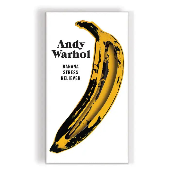 Yellow banana with black splashes on a white background, inspired by Andy Warhol.