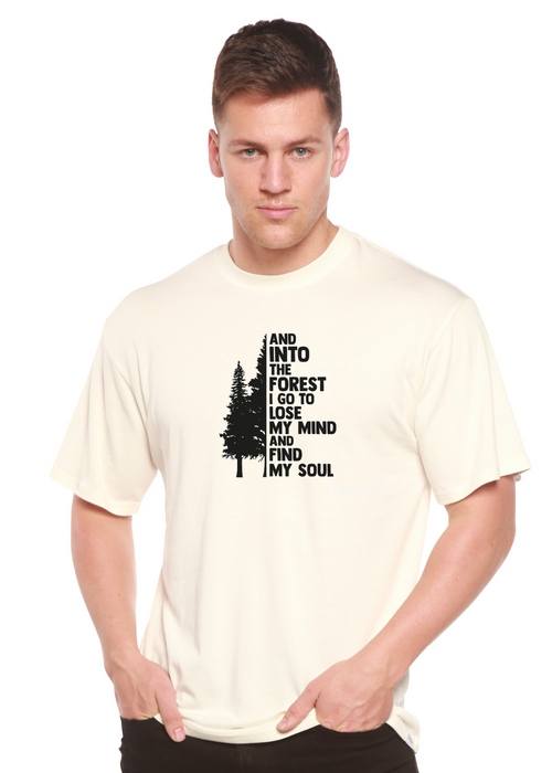 Person wearing a cream t-shirt with a black graphic and text on a white background