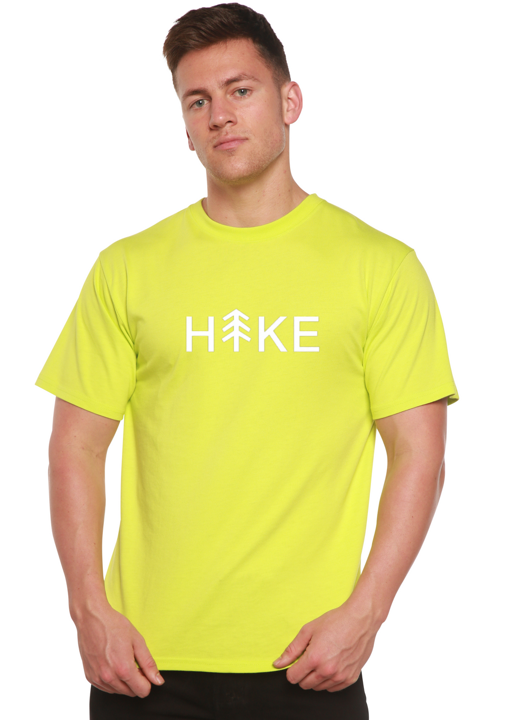 Person wearing a bright yellow t-shirt with 'Hike' printed on it against a white background