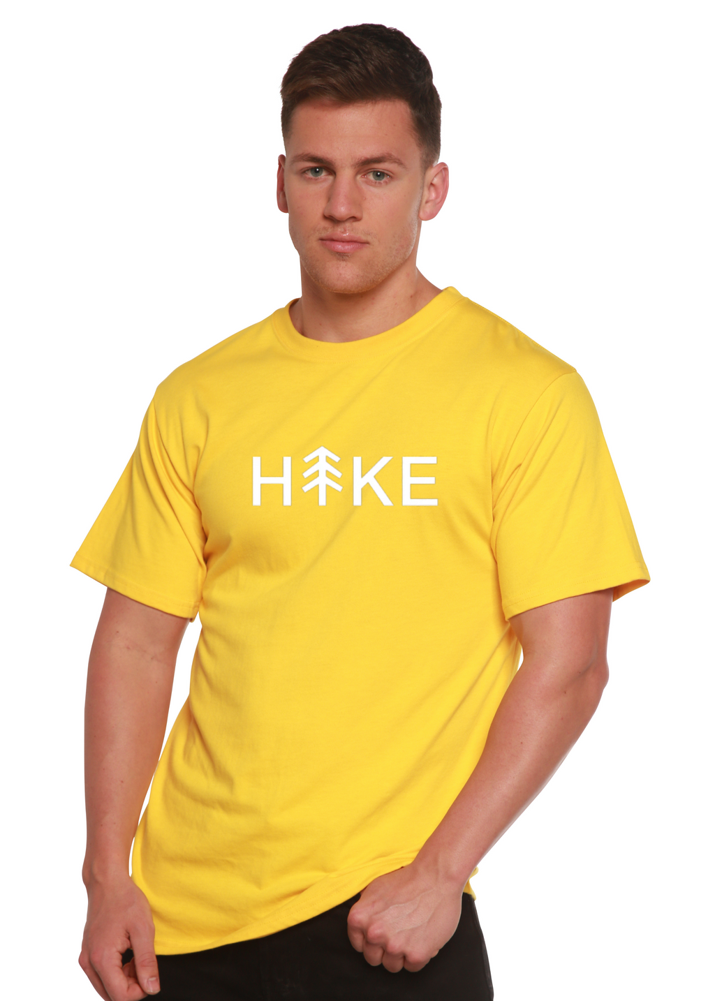 Person wearing a yellow t-shirt with 'Hike' printed on it against a white background