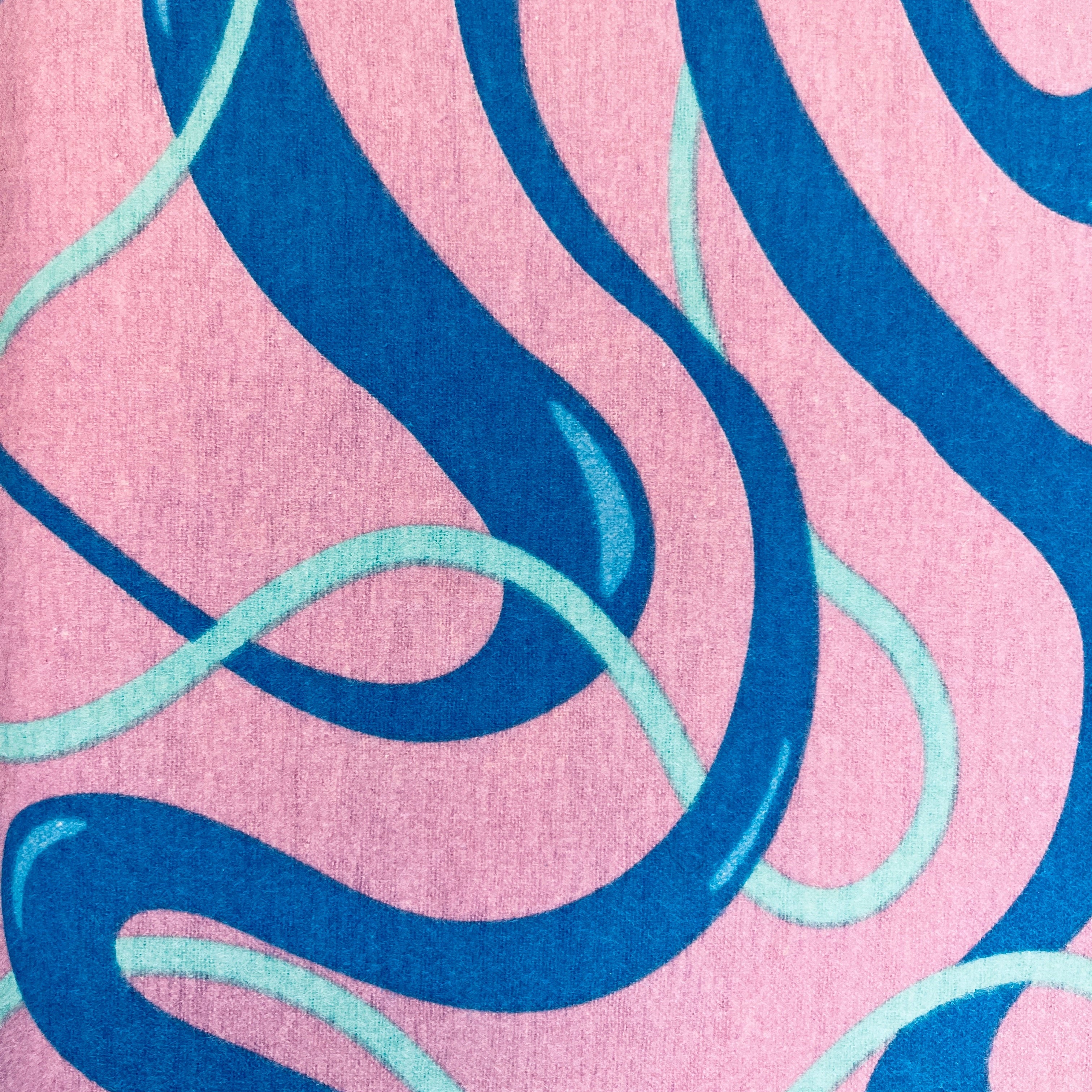 Pink fabric with blue and green wavy patterns