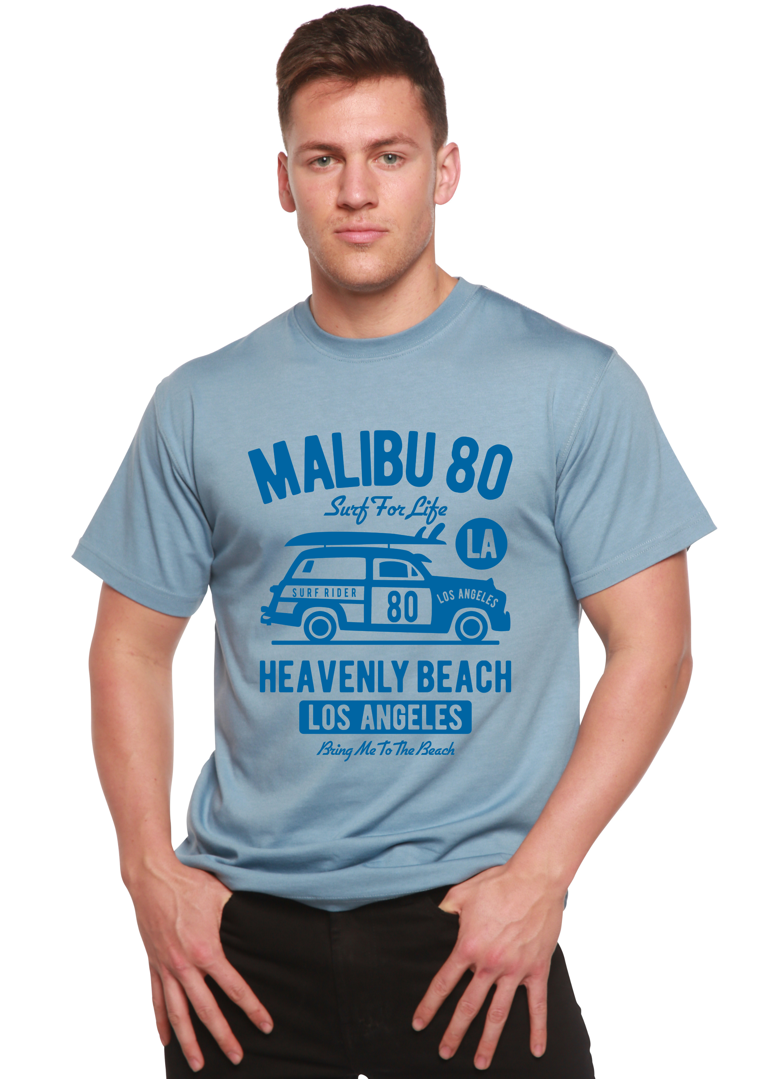 Person wearing a light blue t-shirt with text and graphics on a white background