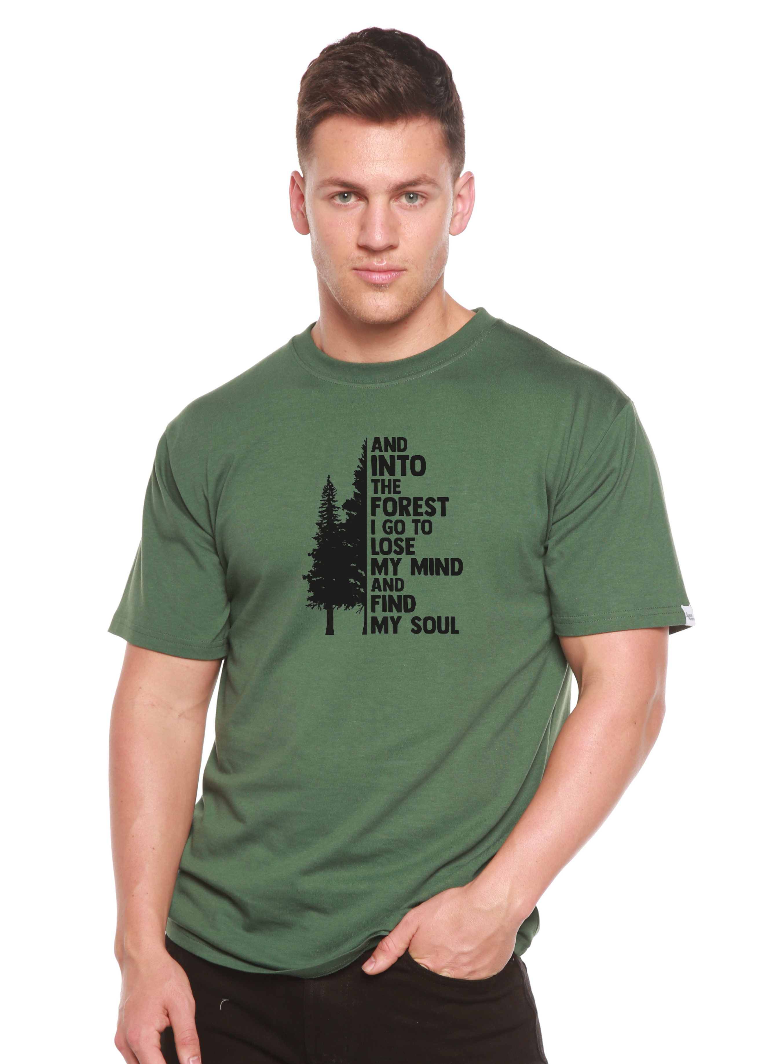 Person wearing a green t-shirt with a forest-themed design on a white background