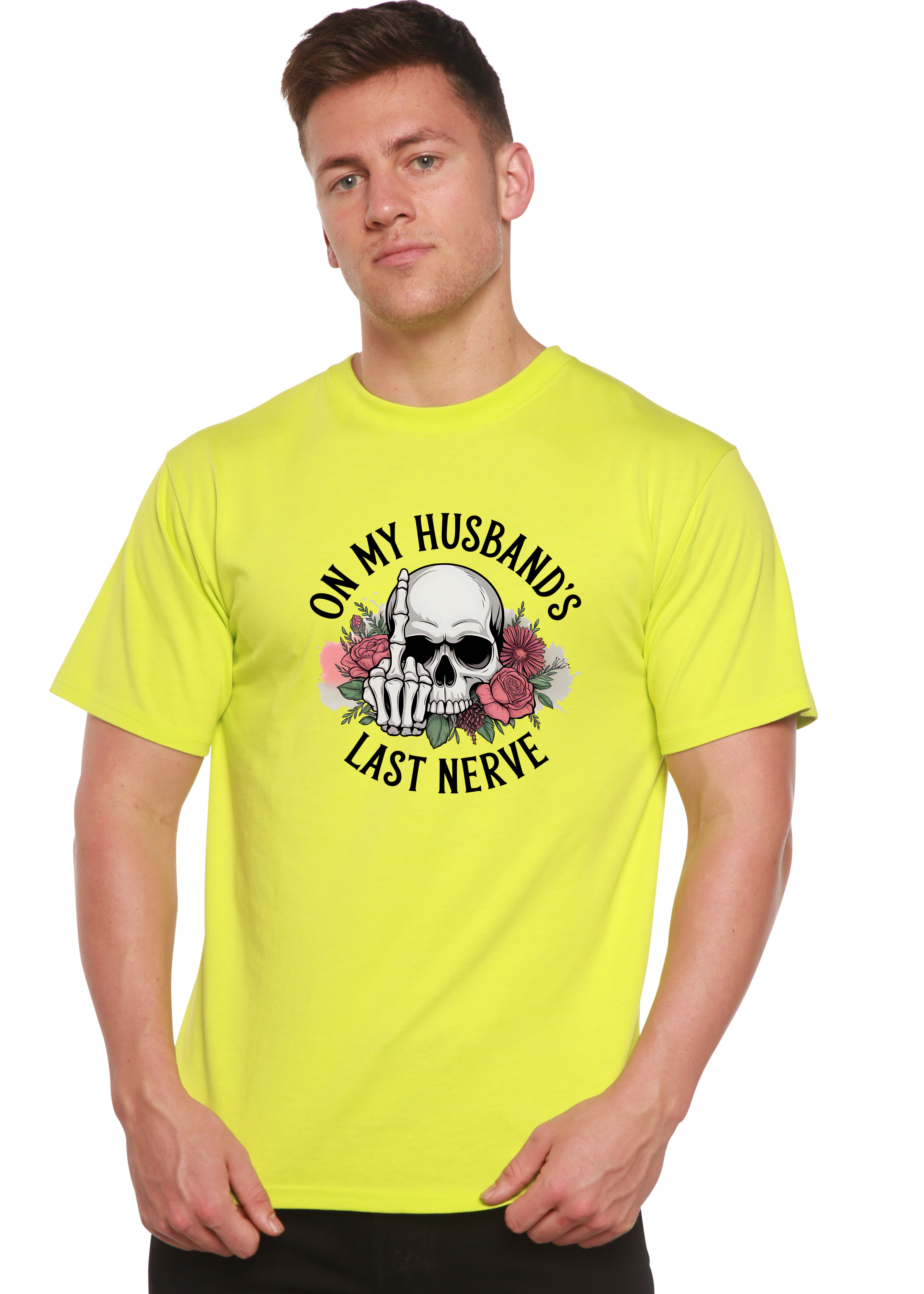 Man wearing a bright yellow t-shirt with a skull design and text 'On my husband's last nerve' on a white background