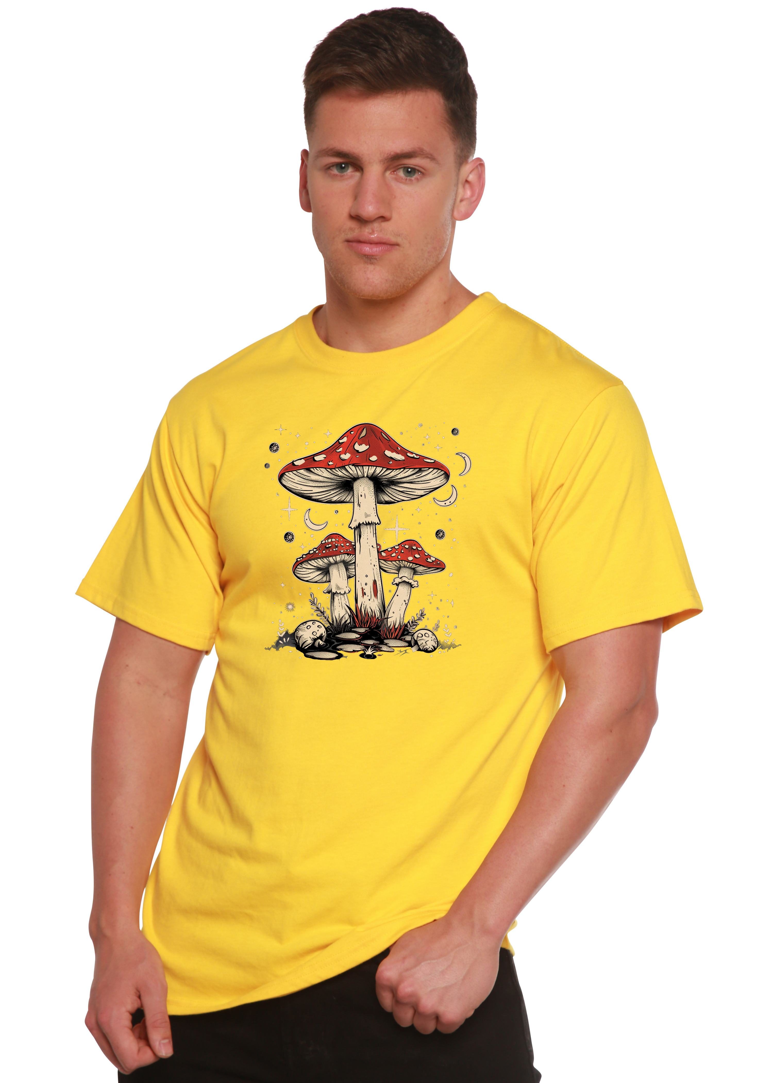 Person wearing a yellow t-shirt with a mushroom design on a white background