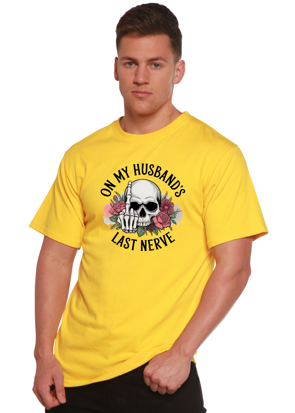Man wearing a yellow t-shirt with a skull design and text 'On my husband's last nerve' on a white background