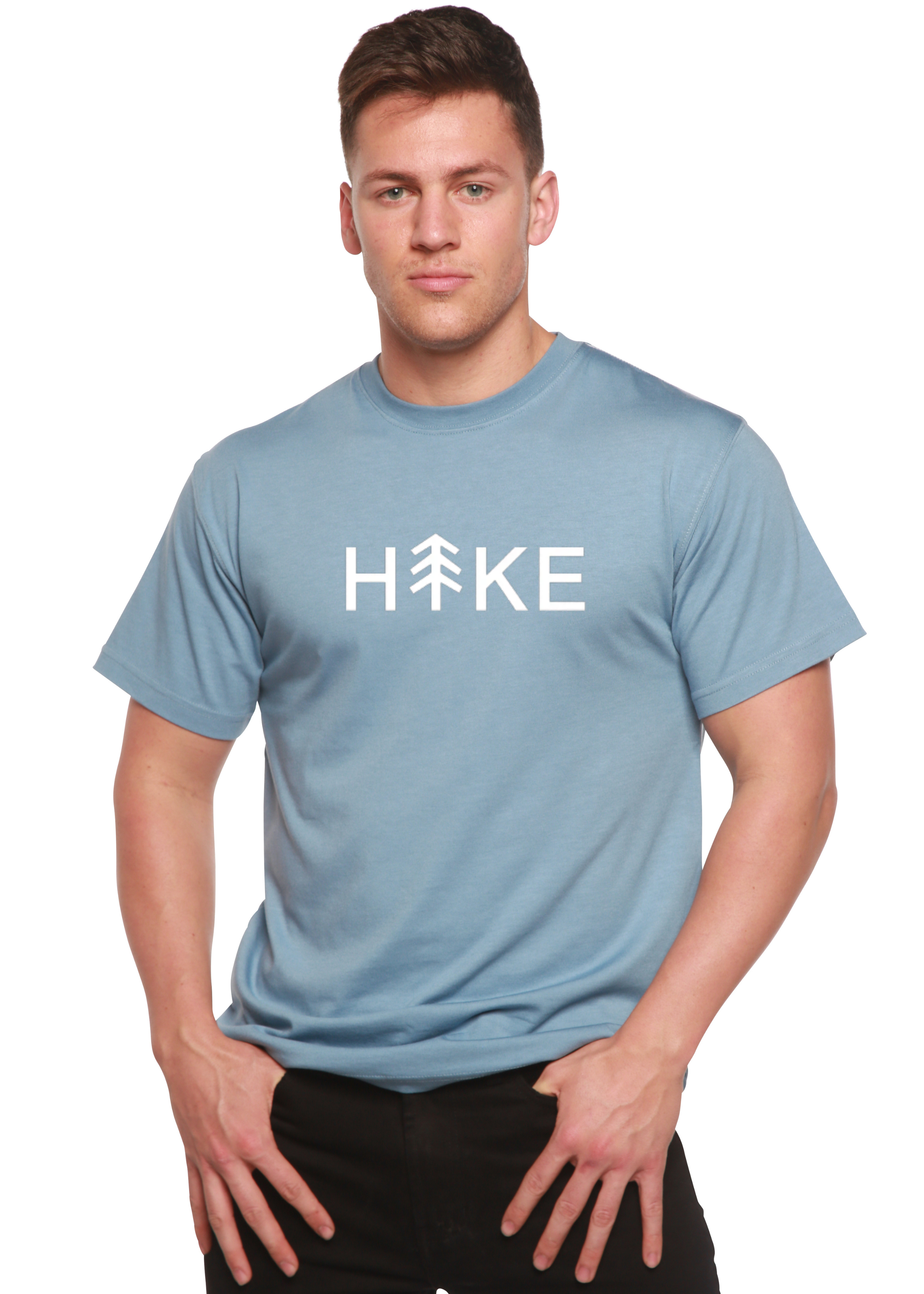 Person wearing a light blue t-shirt with 'Hike' printed on it against a white background