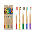 Set of bamboo toothbrushes with colorful bristle tips and packaging labeled 'MamaP'.
