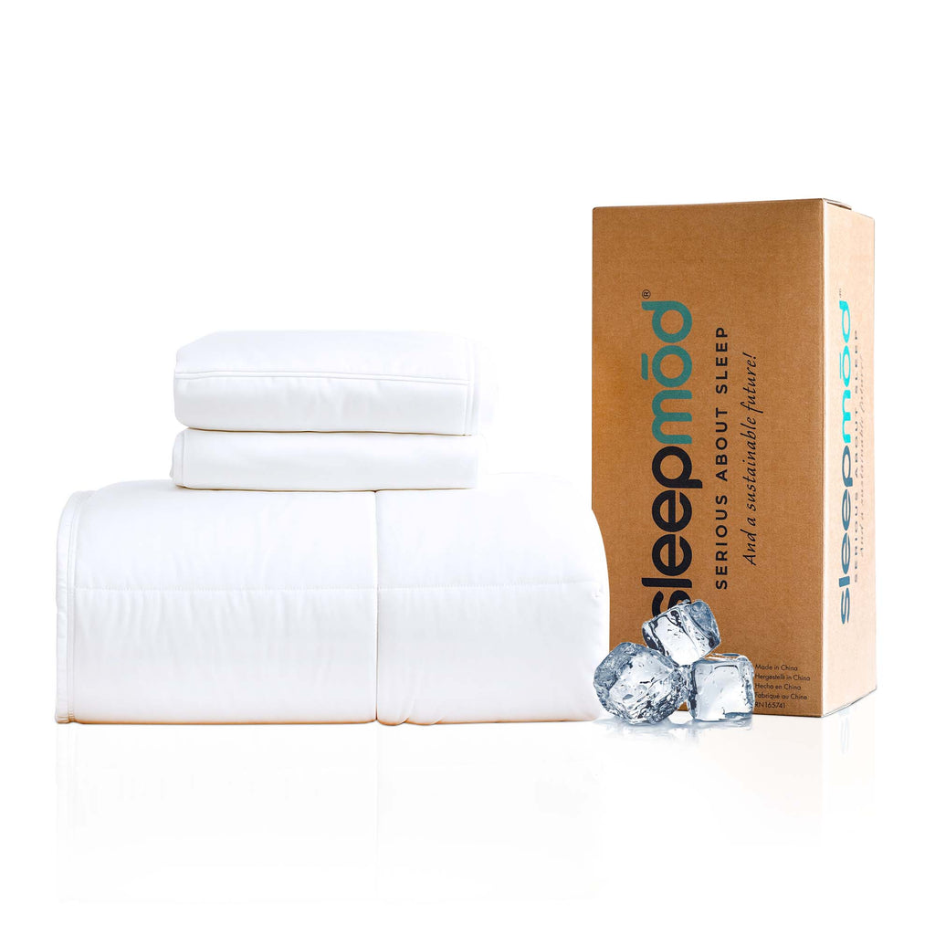 White folded bedding with a cardboard box labeled 'sleepmod' on a white background