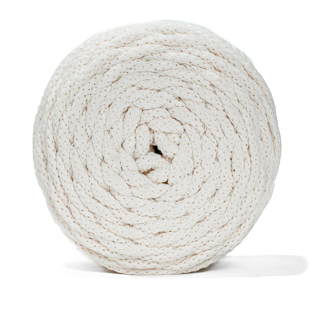 Coiled natural recycled cord on a white background