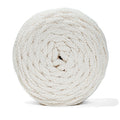 Coiled natural recycled cord on a white background
