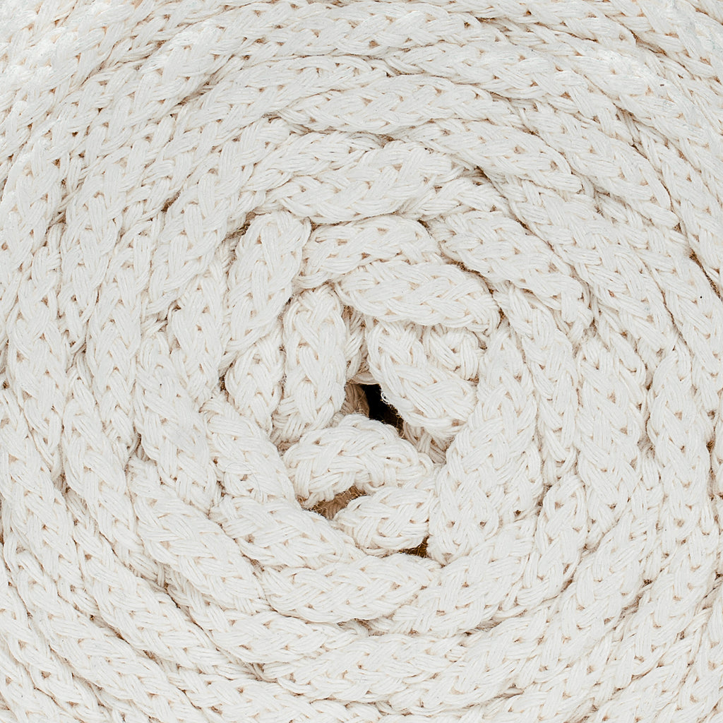 Close-up of a coiled beige recycled cotton cord