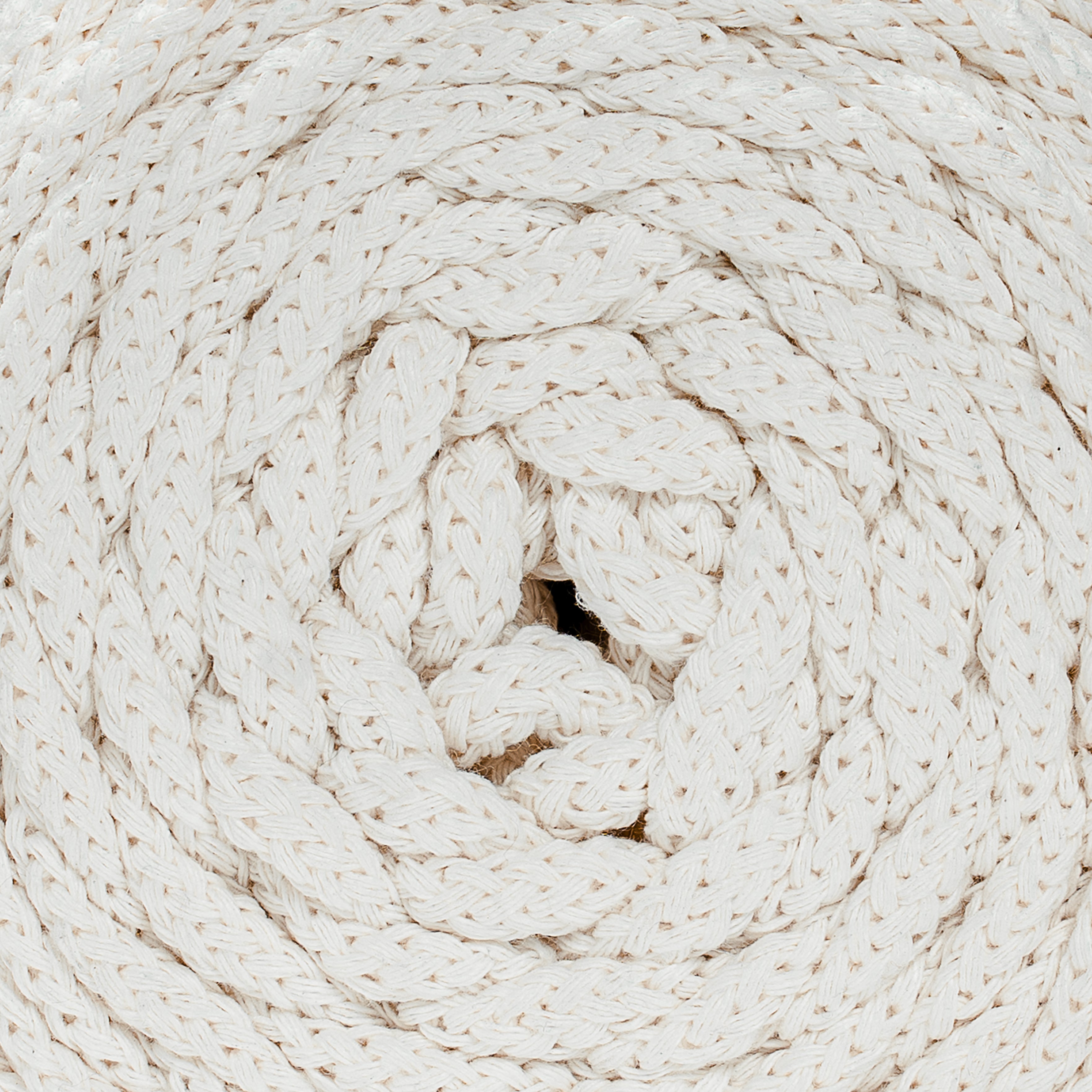 Close-up of a coiled beige recycled cotton cord