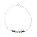 Multicolored beaded anklet on a white background