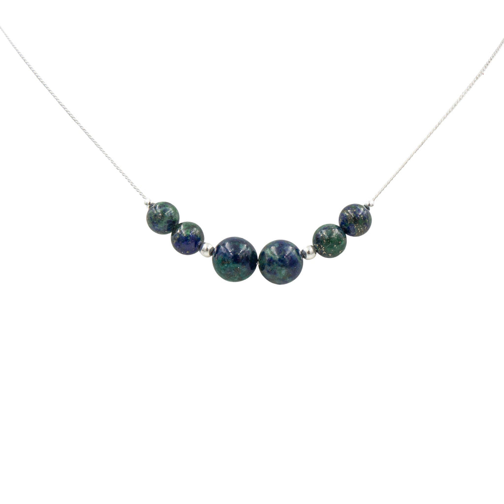 Necklace with 6 blue azurite beads on a white background