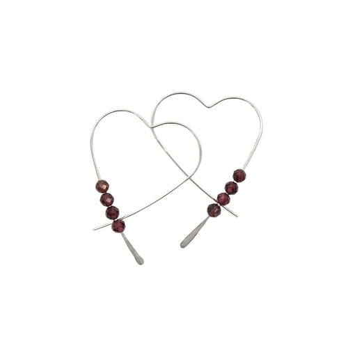 Heart-shaped earrings with red beads on a white background