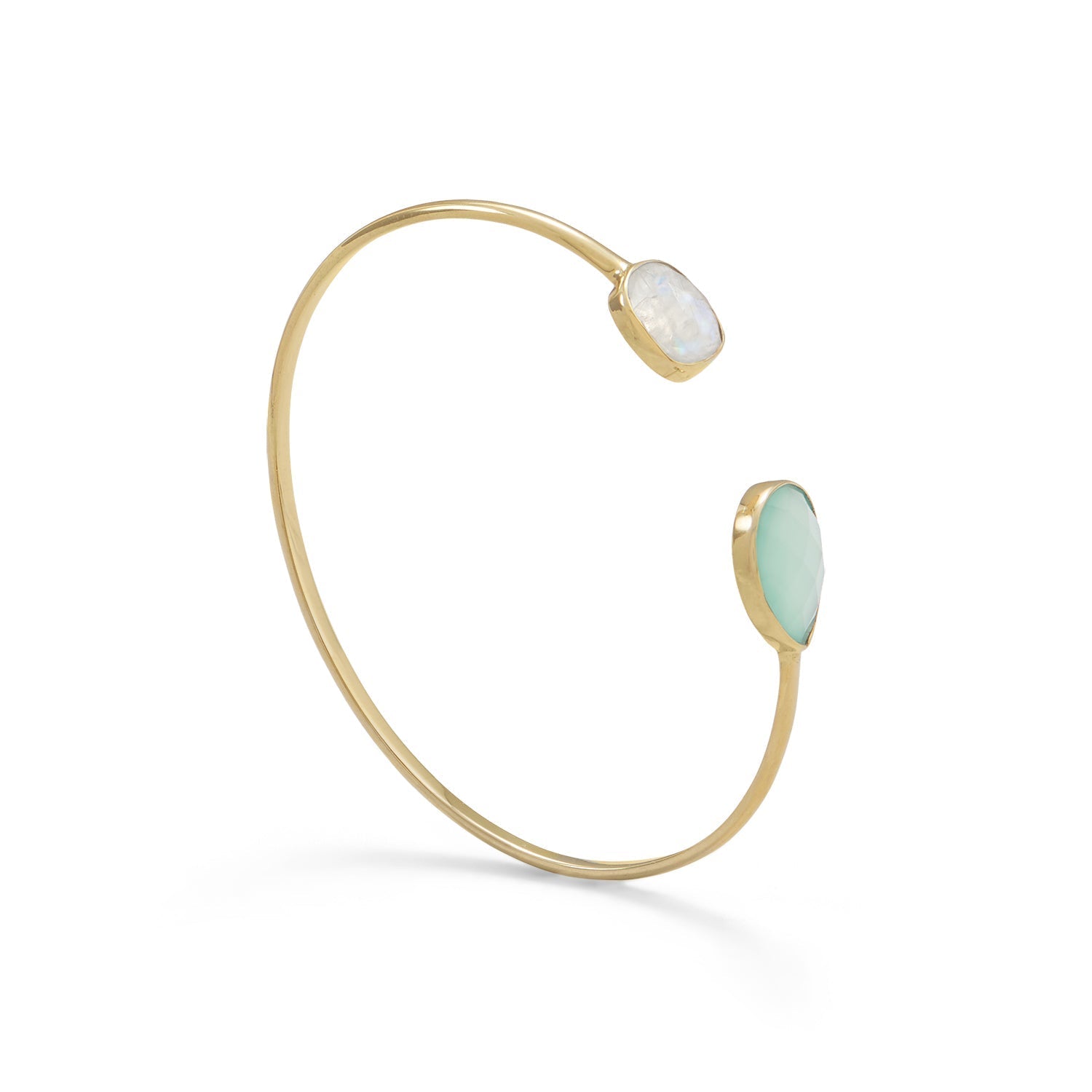 Gold bracelet with two light green stones on a white background
