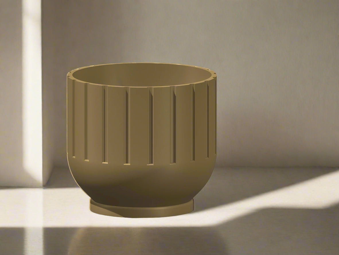 Green planter with ribbed texture on a neutral background