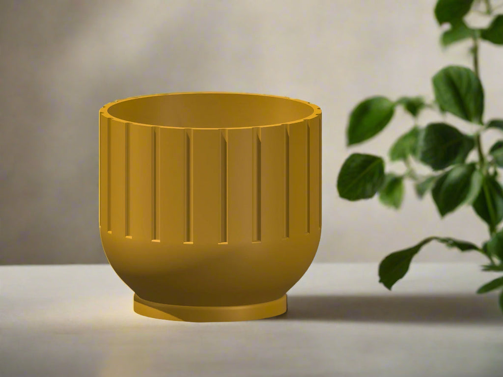 Yellow planter with a textured surface on a light background