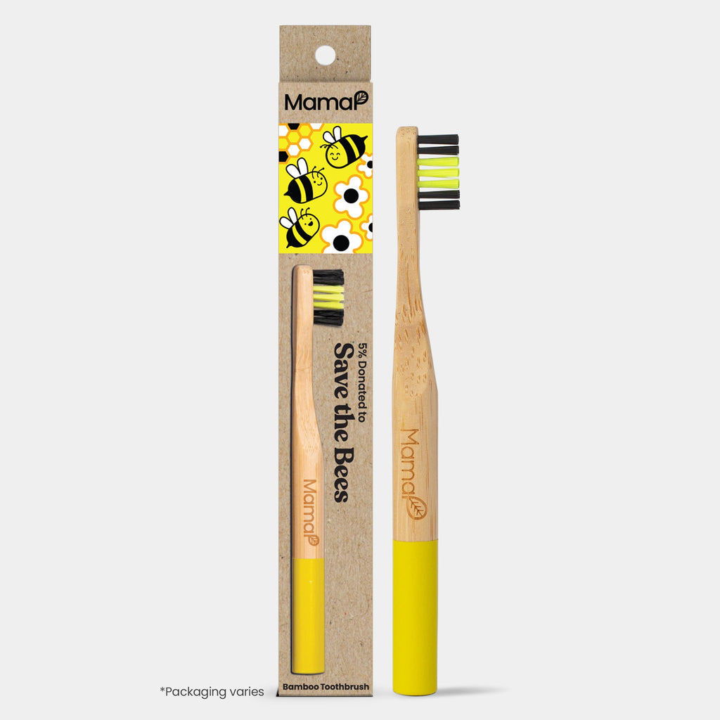 Bamboo toothbrush with yellow and black accents and packaging featuring bee illustrations on a white background.