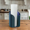 Blue paper towel holder with a roll of paper towels on a wooden table in a kitchen setting