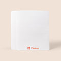 White rectangular sponge towel with 'Plastno' logo on a beige background