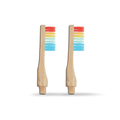 Two wooden toothbrush heads with colorful LGBTQ+ bristle patterns on a white background