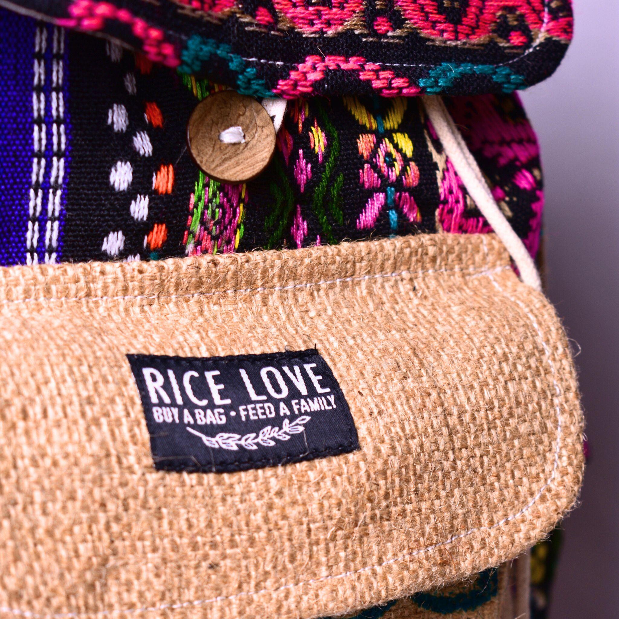 Colorful woven bag with a 'Rice Love' label on a dark background