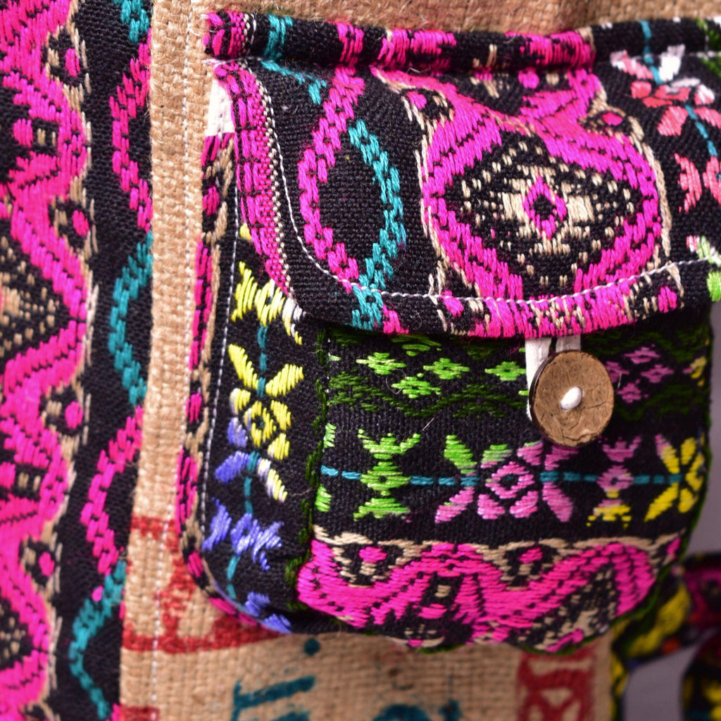 Colorful embroidered bag with intricate patterns on a textured background