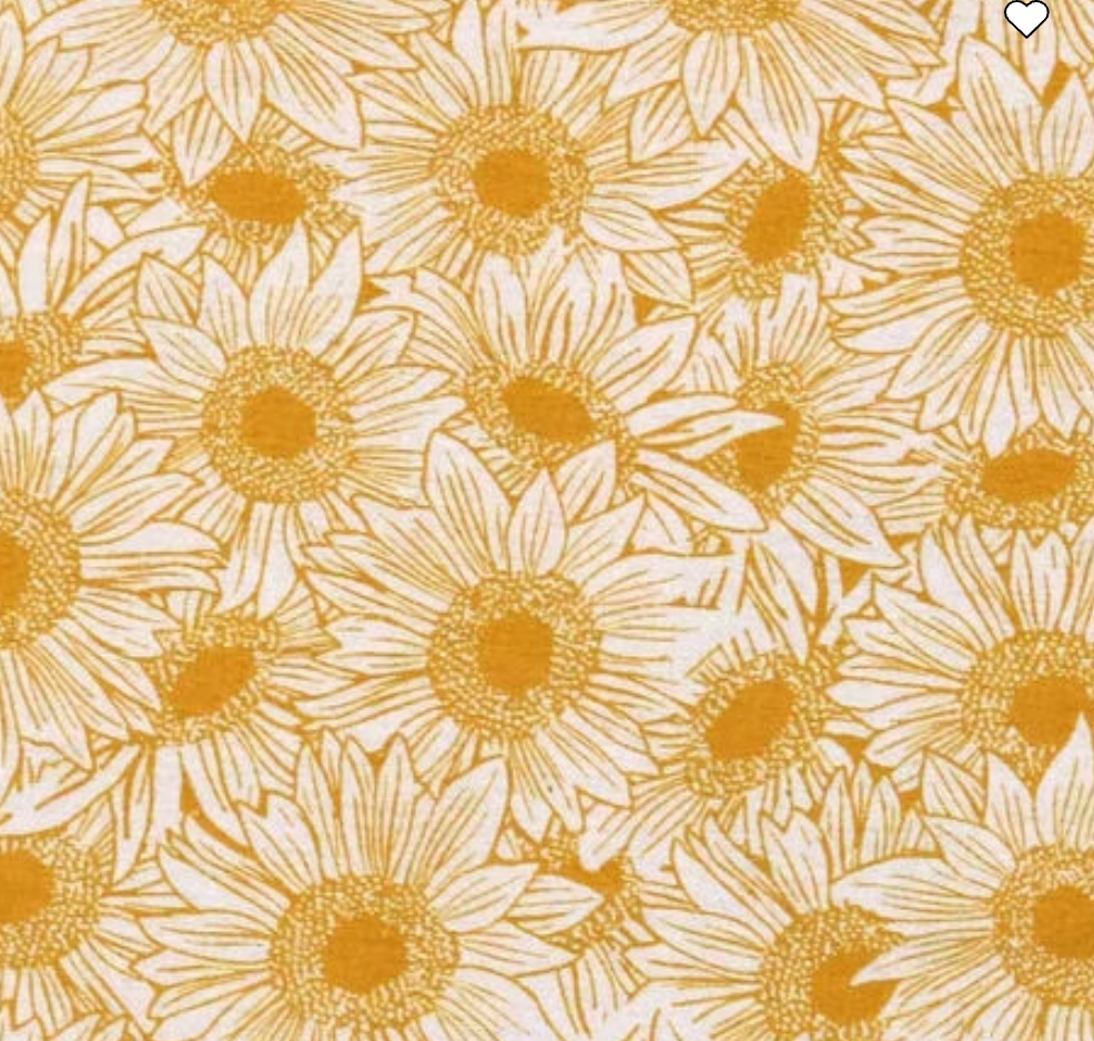 Pattern of sunflowers with yellow centers and white petals on a beige background