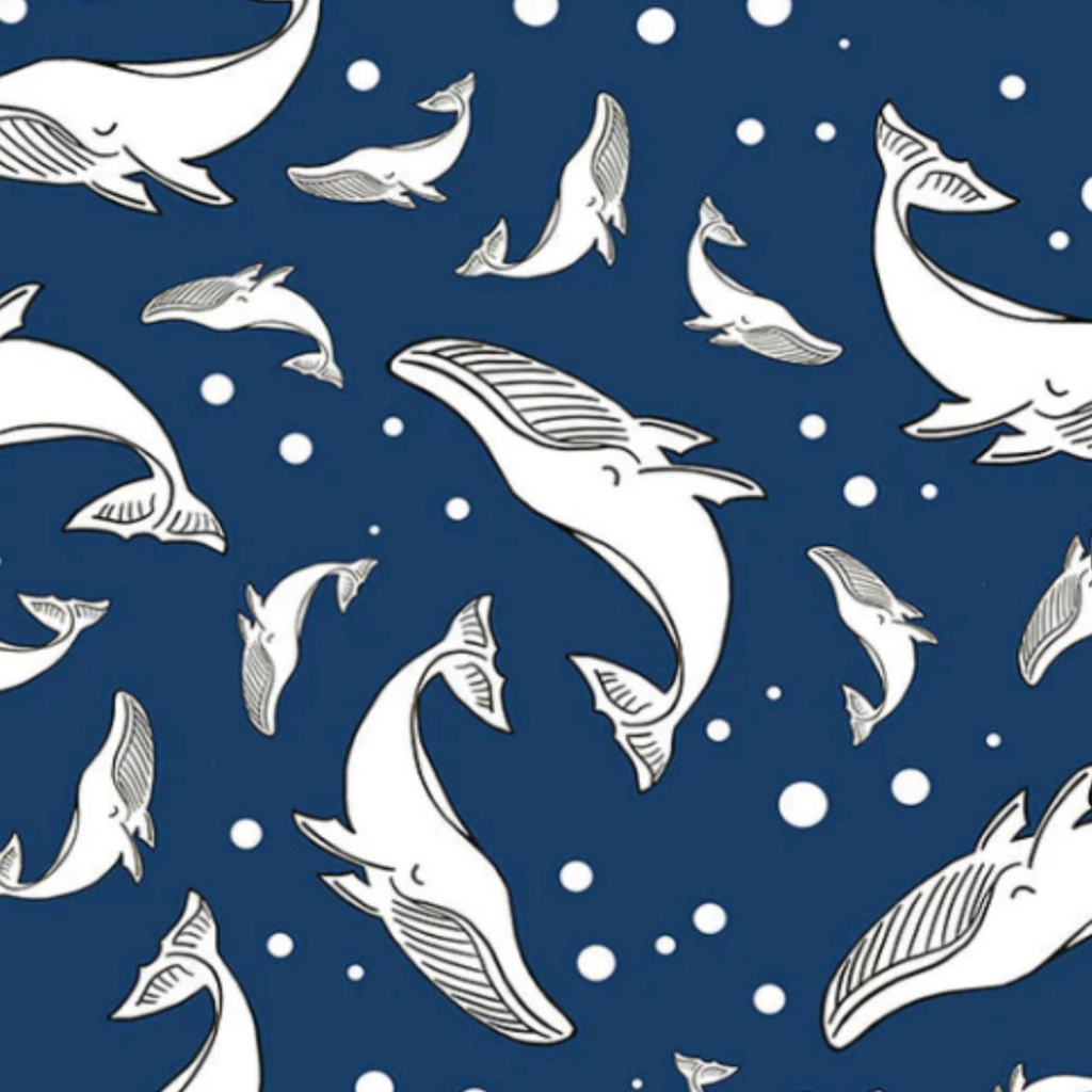 Pattern of white whales on a blue background with white dots