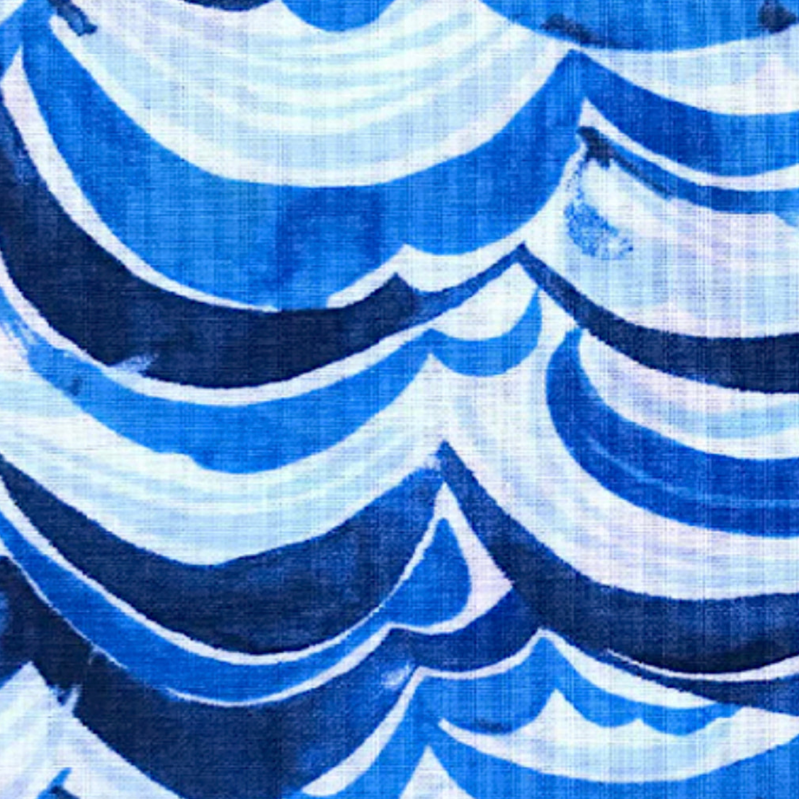 Close-up of blue and white wave pattern fabric texture