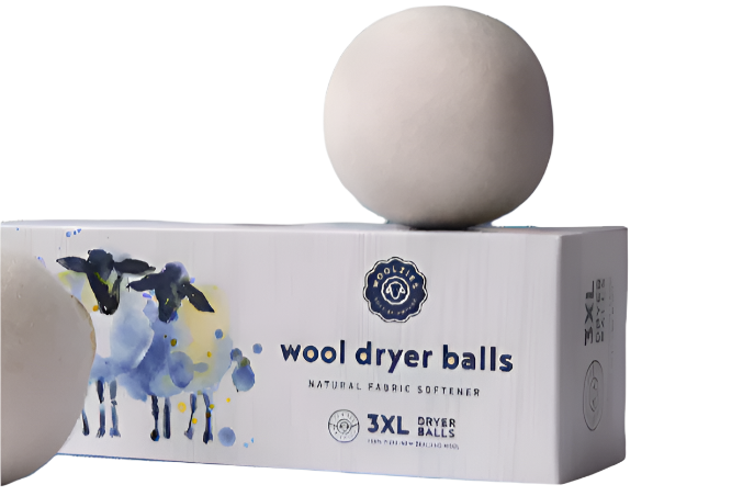 Wool dryer balls with packaging on a white background