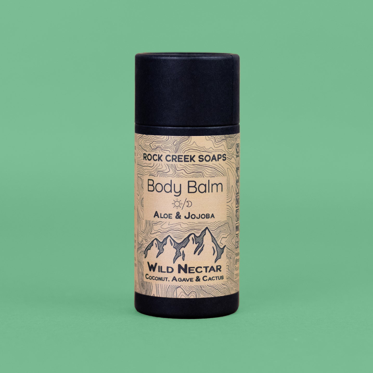 Body balm container with 'Rock Creek Soaps' branding on a green background