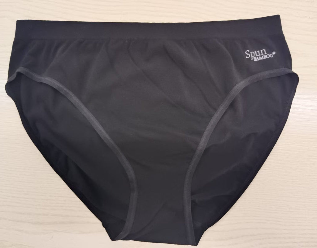 Women's black underwear with ' spun bamboo' label on a beige background