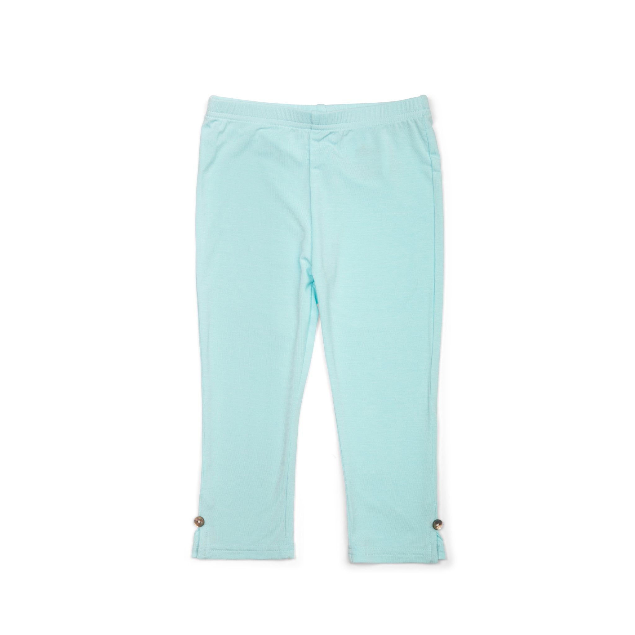Light blue pants with button details on a white background