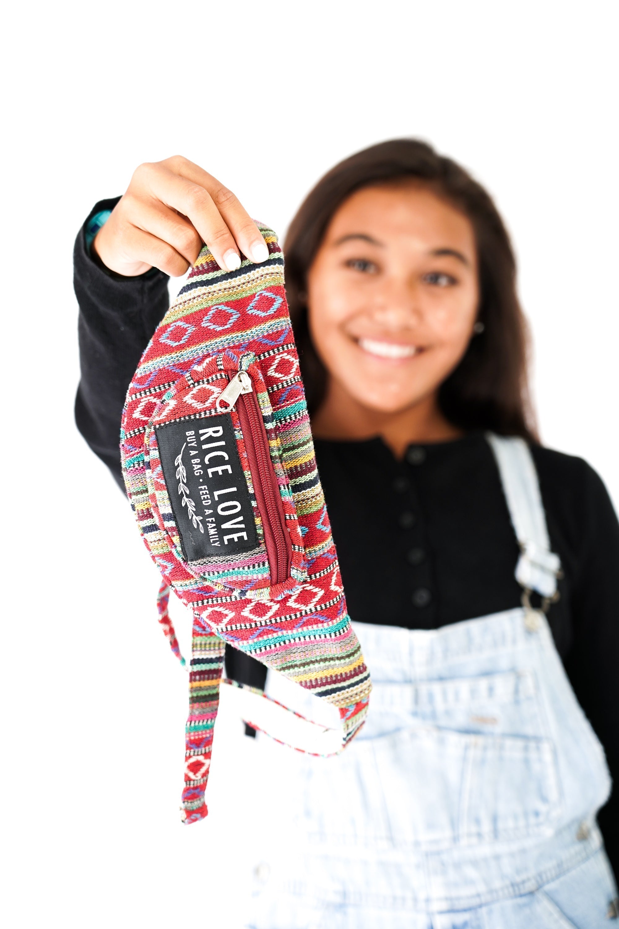 Person holding a colorful sock with 'Rice Love' branding against a white background