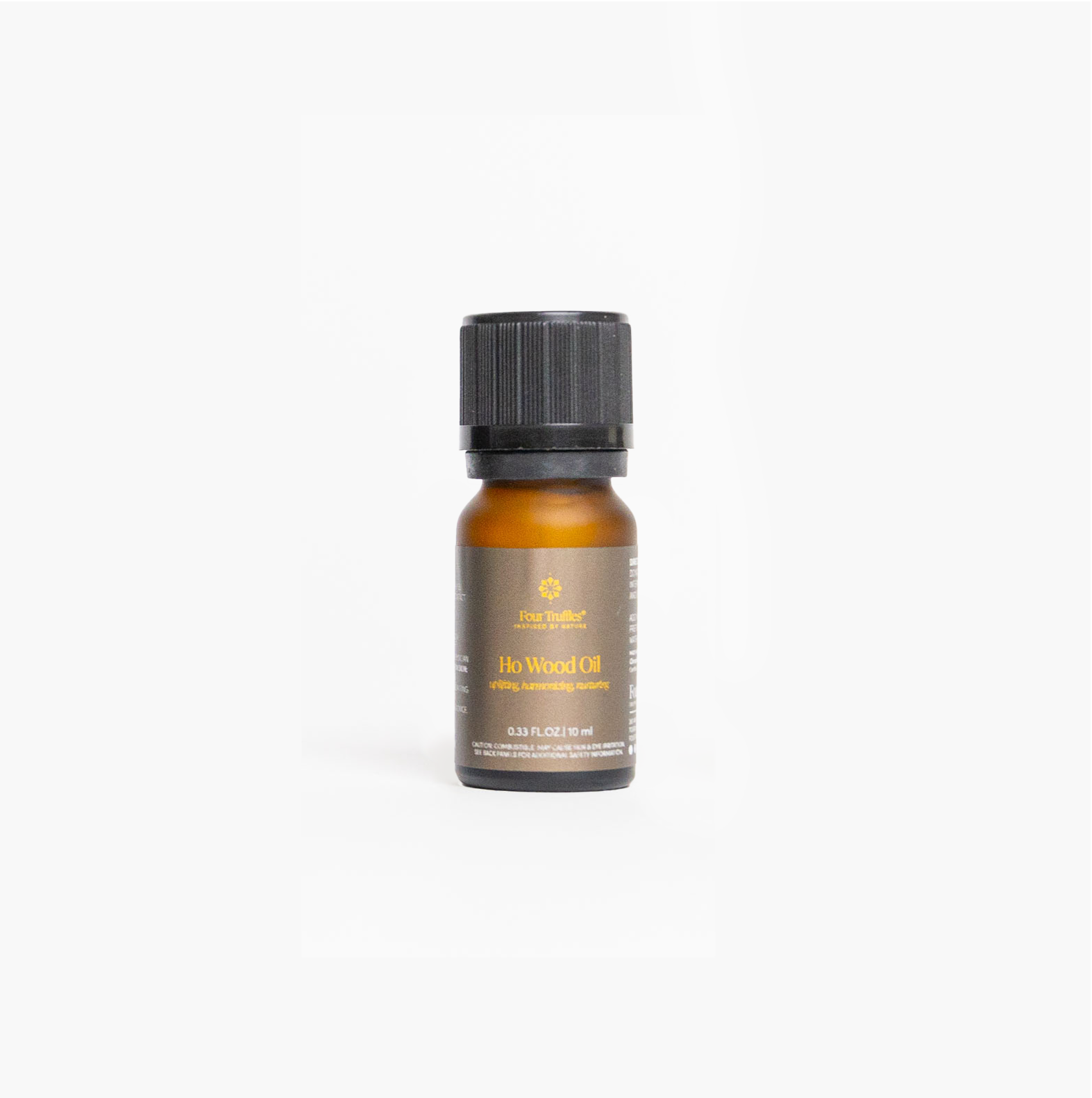 Bottle of Ho Wood Oil on a white background