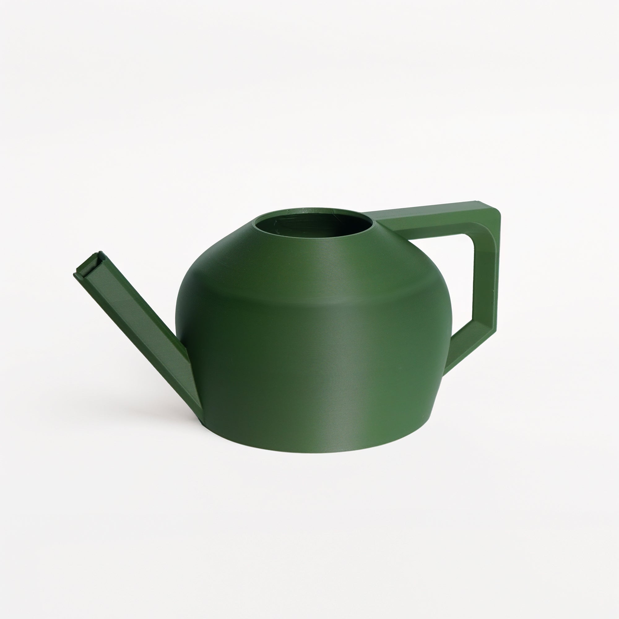 Green watering can on a white background