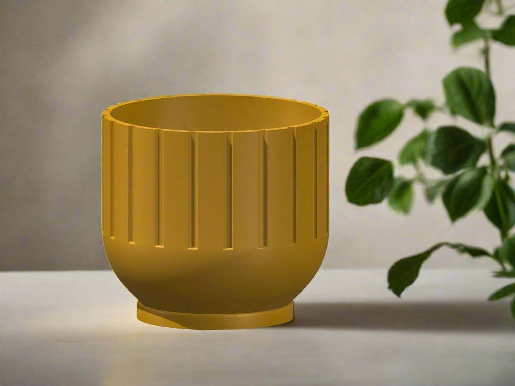 Yellow planter with a textured surface on a light background