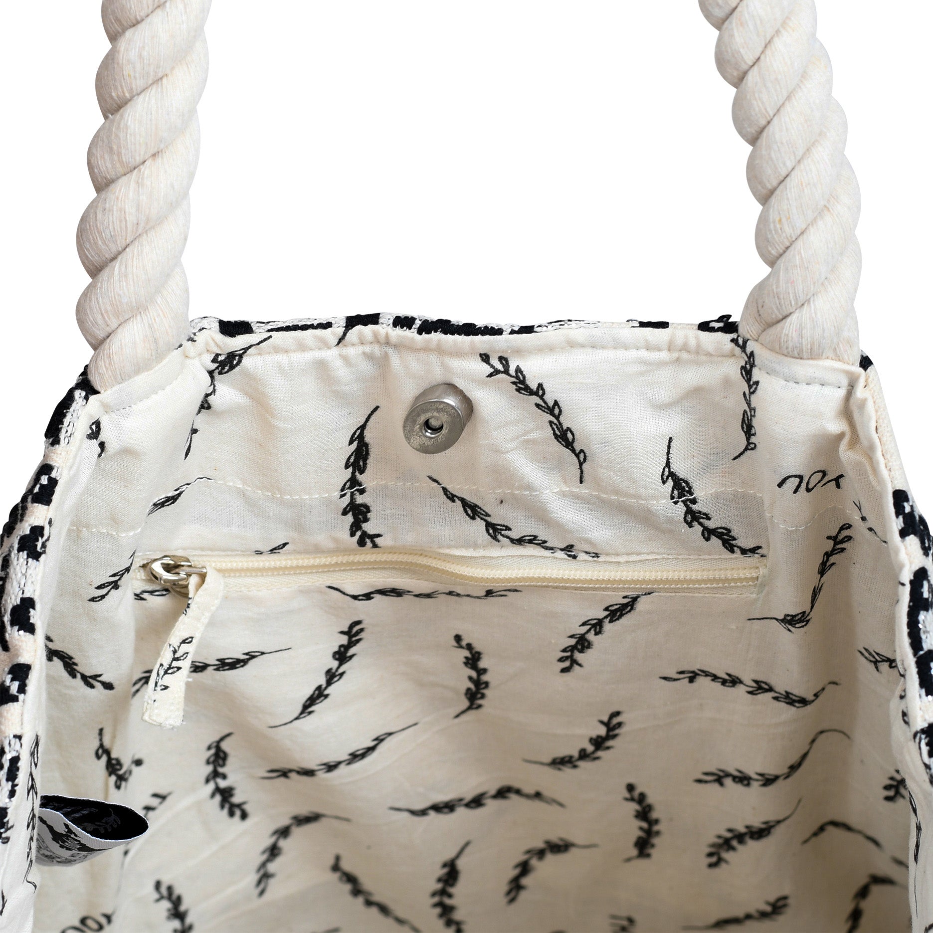 White bag with black rice plant pattern and rope handles on a white background