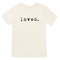 White t-shirt with 'loved.' text on a white background