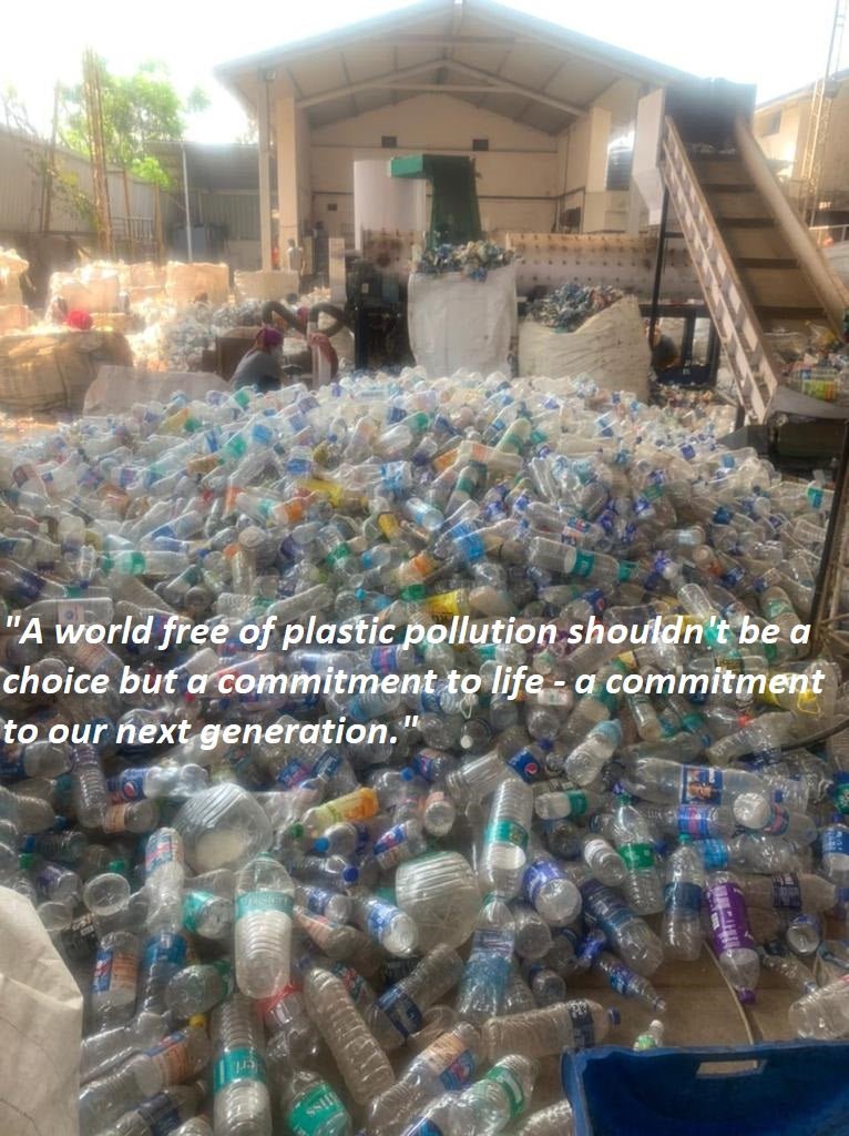 Pile of plastic bottles in a warehouse with recycling text overlay "A world free of plastic pollution shouldn't be a choice but a commitment to life - a commitment to our next generation."