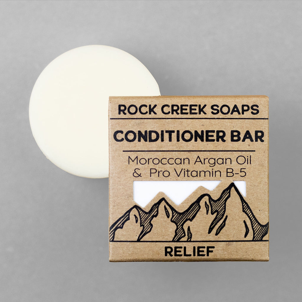 Rock Creek Soaps conditioner bar with packaging on a gray background