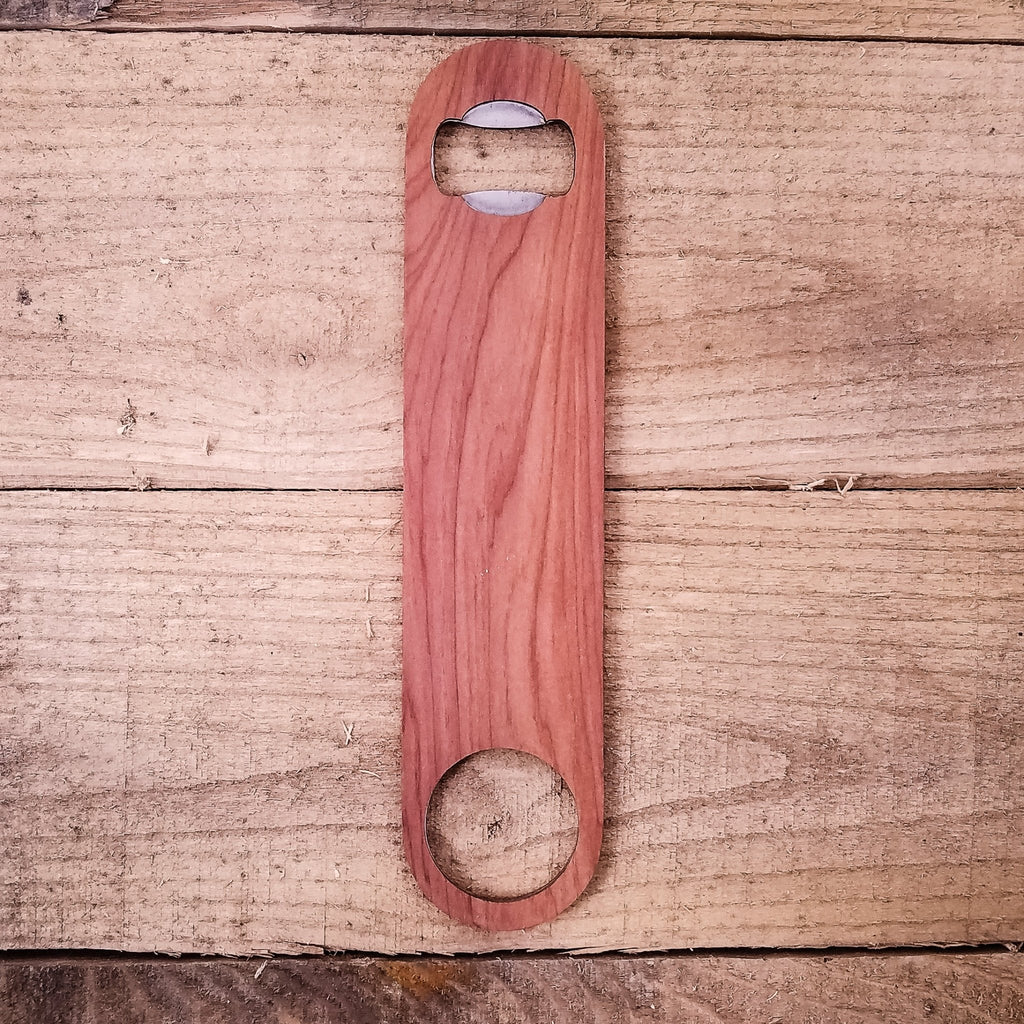 Wooden bottle opener on a wooden surface