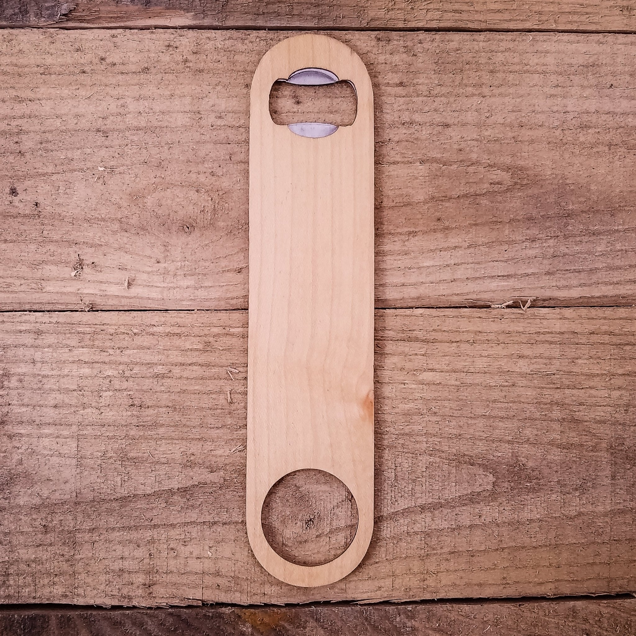 Wooden bottle opener on a wooden surface